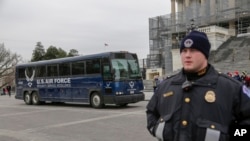 FILE - An Air Force bus waits on the plaza of the Capitol to pick up and transport a congressional delegation. President Donald Trump made such a pickup unnecessary Jan. 17, 2019, when he denied House Speaker Nancy Pelosi and a delegation use of military aircraft for a trip.