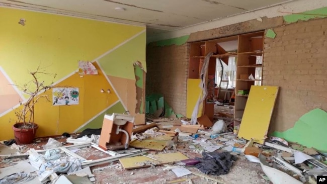 FILE - This April 24, 2022 photo provided by Inna Levchenko shows damage from Russian shelling to School No. 21, in Chernihiv, Ukraine. (Inna Levchenko via AP)