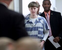 FILE - Dylann Roof enters the court room at the Charleston County Judicial Center to enter his guilty plea on murder charges in Charleston, S.C., April 10, 2017.