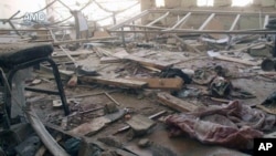 This photo provided by the anti-government activist group Aleppo Media Center, which has been authenticated based on its contents and AP reporting, shows a damaged school that was hit by a Syrian government air strike in Aleppo, Syria, April 30, 2014.