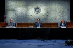 U.S. Senate Majority Leader Mitch McConnell, and U.S. Senate Minority Leader Chuck Schumer meet with Treasury Secretary Steve Mnuchin (C) to work on coronavirus economic aid legislation, on Capitol Hill, in Washington, March 20, 2020.