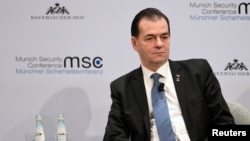 FILE - Romania's Prime Minister Ludovic Orban listens during a panel discussion at the annual Munich Security Conference in Germany, Feb. 16, 2020. 