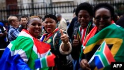 FILE—People queue outside of the South African High Commission in central London on May 18, 2024, to vote in South Africa's forthcoming general election.