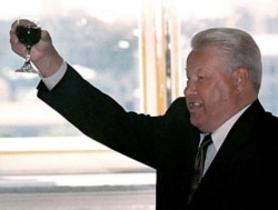 FILE - Russian President Boris Yeltsin makes a toast during a meeting with graduating cadets of Russian military schools June 28, 1999.