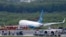 A Boeing passenger plane from China, a Xiamen Air, sits on the grassy portion of the runway of the Ninoy Aquino International Airport after it skidded off the runway while landing, Aug. 17, 2018 in suburban Pasay city southeast of Manila, Philippines. All the passengers and crew of Xiamen Air Flight 8667 were safe and were taken to an airport terminal, where they were given blankets and food before being taken to a hotel. 