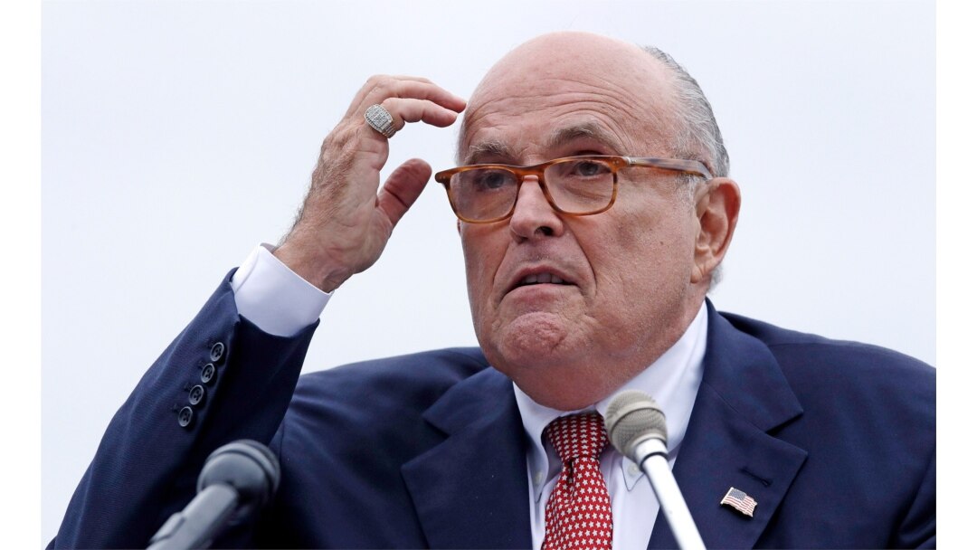 FILE - Rudy Giuliani, as an attorney for President Donald Trump, addresses a gathering during a campaign event in Portsmouth, New Hampshire, Aug. 1, 2018.