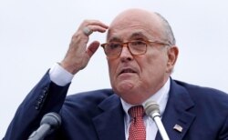 FILE - Rudy Giuliani, as an attorney for President Donald Trump, addresses a gathering during a campaign event in Portsmouth, New Hampshire, Aug. 1, 2018.