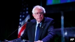 FILE - Democratic presidential candidate Sen. Bernie Sanders pauses while speaking during a forum in Miama, Florida, June 21, 2019.
