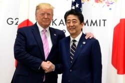 President Donald Trump meets with Japanese Prime Minister Shinzo Abe during a meeting on the sidelines of the G-20 summit in Osaka, Japan, June 28, 2019.