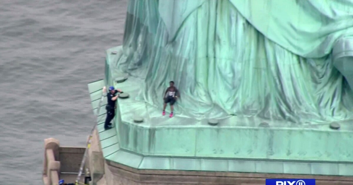Woman Climbs Statue of Liberty in Standoff With Police
