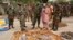FILE - Military officials stand near ammunition seized from suspected members of Hezbollah after a raid of a building in Nigeria's northern city of Kano on May 30, 2013.