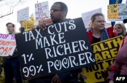 واشنگٹن ڈی سی میں ٹیکس اصلاحات کے خلاف مظاہرہ۔ فائل فوٹو