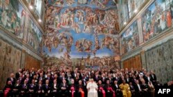 Pope Francis poses for an official photograph with diplomats accredited to the Holy See at the end of the traditional exchange of the New Year greetings, in the Sistine Chapel at the Vatican, January 9, 2020.