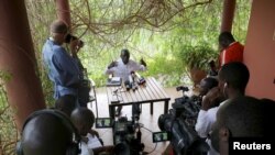 FILE - Journalists attend a news conference following disputed presidential elections, in the outskirts of Kampala, Uganda, Feb. 21, 2016. The country announced new rules for foreign journalists on December 10, 2020, ahead of the January 4 elections.