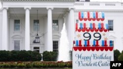 FILE - A sign wishing a happy birthday to former US President Jimmy Carter sits on the North Lawn of the White House in Washington Sept. 30, 2023, ahead of his 99th birthday on Oct. 1.