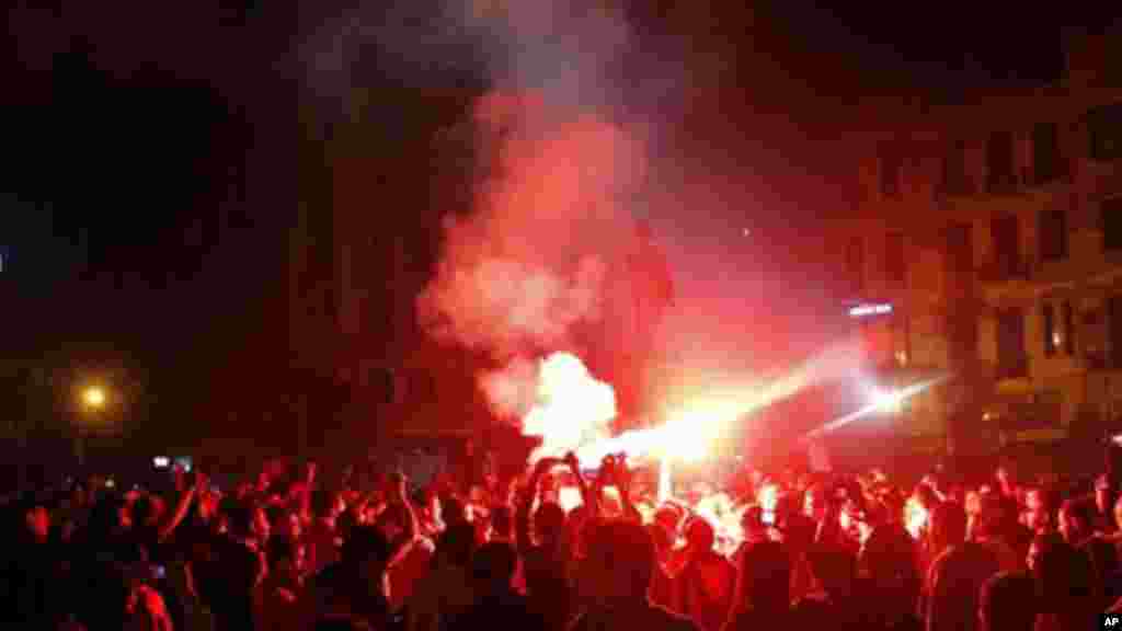 Flares light up a protest in Talaat Harb Square in Cairo, November 26, 2013.