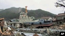 Image taken in Ofunato, Japan, where the port’s tugboat still sits in someone’s backyard about a kilometer from the water, July 2011