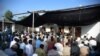 Afghan refugees offer Eid al-Adha prayers at a mosque in the Kazana Refugee camp on the outskirts of Peshawar, Pakistan, July 20, 2021. 