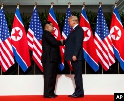 Зустріч президента США Дональда Трампа та північнокорейського лідера Кім Чен Ина, Сингапур, 12 червня 2018. AP Photo/Evan Vucci
