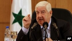 Syrian Foreign Minister Walid al-Moallem speaks during a press conference in Damascus, Syria, August 27, 2013.