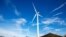 Wind turbines spin to generate electricity power above solar panels in Atlantic City, New Jersey, on Wednesday, February 17, 2021. (AP Photo/Ted Shaffrey)