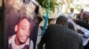 FILE - Family react during a funeral ceremony for Mario Jn Louis, a police officer killed by armed gangs in Port-au-Prince, Haiti, on Dec. 19, 2024.