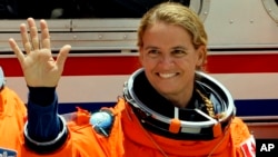 Mission Specialist Julie Payette, of Canada, prepares to board the space shuttle Endeavour, July 15, 2009, at the Kennedy Space Center in Cape Canaveral, Fla. Payette, now retired, is reported to be named the next governor general and Queen Elizabeth's representative in Canada.