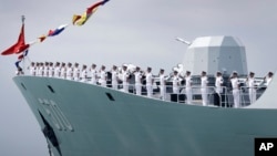 FILE - China's frigate Huangshan is seen anchored in the waters off RSS Singapura Changi Naval Base, May 15, 2017, in Singapore. China and members of the Association of Southeast Asian Nations will engage in naval exercises next year.