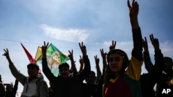 FILE - Supporters of pro-Kurdish Peoples' Equality and Democracy Party (DEM Party) chant slogans during the Newroz celebrations, in Istanbul, Turkey, on March 17, 2024. 