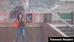 Typhoon Chanthu brings winds and rain in Taipei