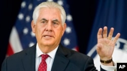 FILE - Secretary of State Rex Tillerson gestures while speaking to State Department employees.