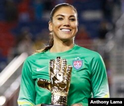 United States' goalkeeper Hope Solo (1) poses with the golden glove award after the SheBelieves Cup, March 9, 2016, in Boca Raton, Florida.