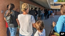 Voters wait to cast their ballots at a polling place in central Phoenix on Nov. 8, 2022. The U.S. Supreme Court on Aug. 22, 2024, declined a Republican request that would have kept tens of thousands of Arizonans from voting in the Nov. 5 presidential election.