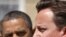 Britain's Prime Minister David Cameron (R) speaks during a joint news conference with U.S. President Barack Obama at Lancaster House, in central London, May 25, 2011