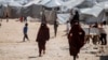 Anak-anak berlarian di kamp al-Hol yang menampung keluarga anggota ISIS di provinsi Hasakeh, Suriah, Rabu, 19 April 2023. (AP/Baderkhan Ahmad)