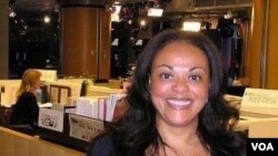 VOA web editor Sandra Lemaire at her desk in the newsroom.