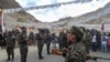 FILE - Indian soldiers pay their respects during the funeral of their comrade, Tibetan-origin India's special forces soldier Nyima Tenzin, in Leh, Sept. 7, 2020.