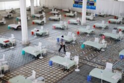 FILE - Beds are seen inside a Gurudwara (Sikh Temple) converted into a coronavirus care facility amidst the spread of COVID-19 in New Delhi, India, May 5, 2021.