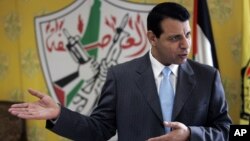 FILE - Palestinian Fatah leader Mohammed Dahlan gestures as he speaks during an interview with The Associated Press in his office in the West Bank city of Ramallah, Jan. 3, 2011.