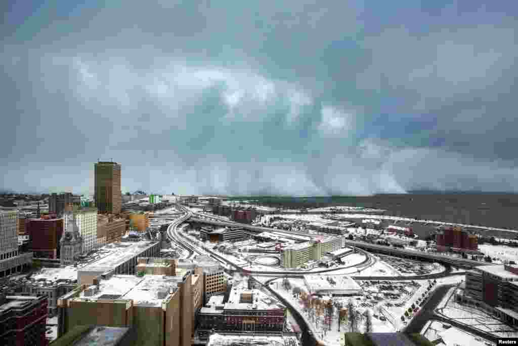 Storm clouds and snow blows off Lake Erie in Buffalo, New York, Nov. 18, 2014. 