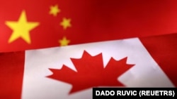 Printed Chinese and Canada flags are seen in this illustration, July 21, 2022