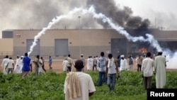 Sudanese demonstrators attack the U.S. embassy as they protest an anti-Islam film, in Khartoum, September 14, 2012.