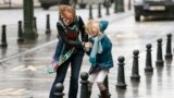 A woman and her daughter struggle against strong winds and rain in central Brussels, Belgium. According to local media, the winds could reach speeds of over 100 km per hour (62 miles per hour).