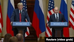 Helsinki, Finland -- Russian President Vladimir Putin and Presidend Donald Trump speak at a joint news conference following their meeting Monday, July 16, 2018.