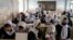 FILE - Afghan school girls attend their classroom on the first day of the new school year, in Kabul, March 25, 2023. Girls are not allowed to study beyond sixth grade.