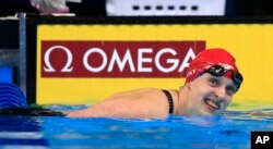 Katie Ledecky smiles after winning the women's 200-meter freestyle final at the U.S. Olympic swimming trials in Omaha, Neb., Wednesday, June 29, 2016.