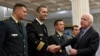 U.S. Sen. John McCain (right) shakes hand with Montenegrin army officers in Podgorica, Montenegro, April 12, 2017. McCain has congratulated Montenegro for its upcoming NATO membership, blasting Russia for its attempts to interfere in the Balkans.