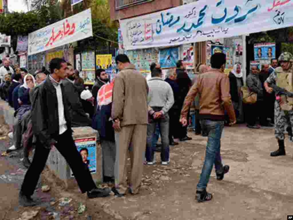 An Egyptian soldier stands guard at a polling station in Alexandria. (AP)