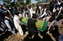 FILE - Afghans take part in a burial ceremony of a journalist, in Kabul, Afghanistan, June 7, 2016. Fifteen journalists were reportedly killed in the country in 2018.