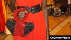 Model poses with a handbag made from recycled paper and beads by Cameroon businesswoman Jacqueline Kamsu. (Kamsu)